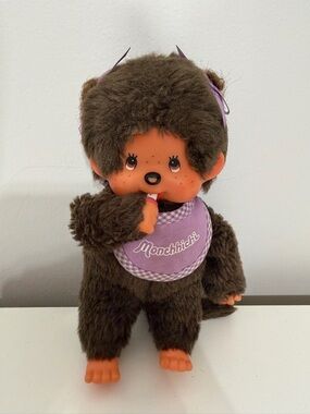 Monchhichi Plush Doll in Brown with Purple Bib